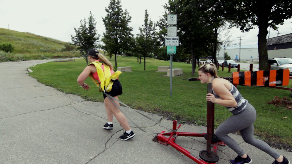 Richard burr fitness winnipeg personal trainer outdoor training women weight sled park 02a90083 cfba 4811 8150 f8ba8a689f3d